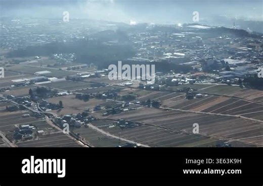 Aerial view of fields and small buildings Stock Video Footage - Alamy