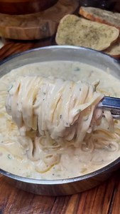 Bacon Jalapeño Fettuccine Ingredients: - 1 lb bacon - 10 diced jalapeños (optional) - 5 minced garlic cloves - 4 tbsp butter - 1/2 cup flour - 2 cups chicken broth - 8 oz cream cheese - 2 cups heavy cream - 1/2 tsp salt, pepper, onion powder, and dried parsley - 1/2 cup shredded Parmesan cheese - 8 servings fettuccine (cooked to al dente) Instructions: Cut the bacon into small pieces, then fry in a deep skillet until crispy. To the bacon grease in the same pan, sauté the jalapeños until soft, th