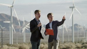 One man shows the partner the vizualization of the project in the tablet
