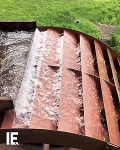 198K views · 1.1K reactions | Flowing water turns an overshot wheel, converting kinetic energy into mechanical power for grain milling.  deeprootsmilling / IG | Interesting Engineering | Facebook