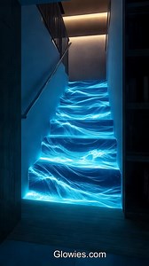 Imagine walking on glowing water staircases that light up with every step! These magical stairs look like flowing water, shining in bright blues and purples. At night, they glow like a dreamy waterfall, making you feel like you’re in a fairy tale. It’s like stepping on a glowing river, leading you to an adventure! | Glow Lockets by Monique Lula