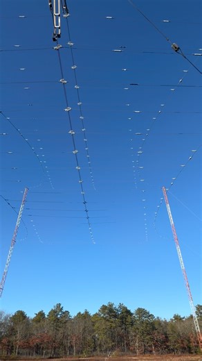 This isn’t power distribution — it’s communications infrastructure on a massive scale. What you’re seeing here is a large HF curtain array supported by multiple towers and hundreds of tensioned wire elements. These systems are designed to shape and direct radio energy over extreme distances, often spanning continents by using the ionosphere rather than satellites. The towers provide structure, but the real engineering is in the geometry: wire spacing, tension, orientation, and grounding all work