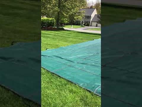 Folding a safety cover for spring storage