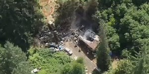 House fire spreads to trees, burns ‘several’ homes near Banks