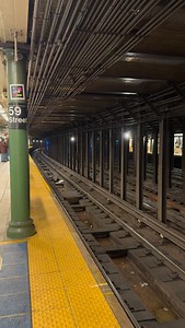 On the platform waiting for the NYC subway 1 train as the A train passes on the center track. | Bryan Burton Photography