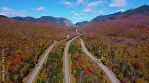 Franconia Notch State Park and Interstate Highway I-93 aerial view facing Franconia Notch in White Mountain National Forest with fall foliage, Town of Lincoln, New Hampshire NH, USA.