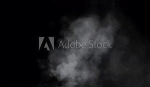 Smoke Overlay. This stock motion graphics video shows puffs of white smoke rising on a transparent background.