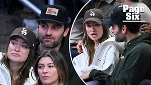 Olivia Wilde cozies up to actor Dane DiLiegro at a Los Angeles Lakers game