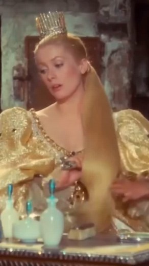 Vintage Icons on Instagram: "Catherine Deneuve in “Peau d’âne” (1970). Costume design by Gitt Magrini. Magrini is perhaps best known for her work on “L’Eclisse” (1962). The film, like all proper fairy tales, frees itself from any precise historical reference, and, as in Michel Legrand’s harpsichord-electric-fusion score, styles and epochs coexist. “One must feel the fabrics,” wrote Director Jacques Demy in his preparatory notes. Sequins, baubles, jewels of all hues, veils, pearls, decorative exc