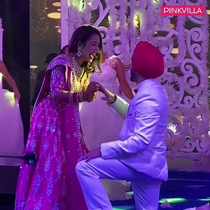 198K views · 66 shares | It is finally happening! Neha Kakkar and Rohanpreet Singh are sharing adorable little sneak peeks from all their wedding ceremonies and netizens can't keep calm! We just saw their Sangeet ceremony where the groom went down on his knee for the singer and we are all hearts. Watch Neha look gorgeous in that pink lehenga set with beautiful silver work on it. The couple couldn't stop glowing! | PinkVilla | Facebook