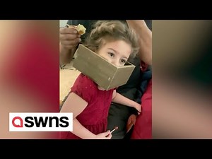 Funny moment 5-year-old gets box shelf stuck on her head after using it as crown | SWNS
