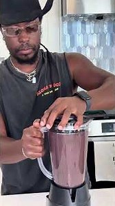 Slow-cooked black beans seasoned with aromatic Haitian spices, creating a rich, creamy, flavorful