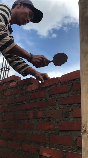 How to install red brick using cement and mountain sand mixture.
