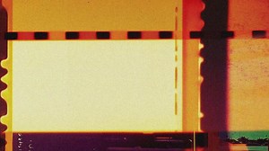old film frames in fast stop motion animation with cinematic colors for dynamic overlay effect and transitions, red and yellow film frames with grain and noise