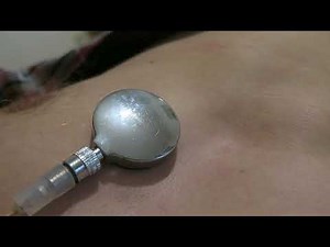 Visible heartbeat lying down (semi-SFW: bare male chest)