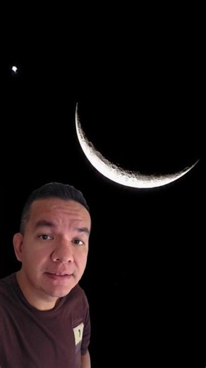 Mysterious dot by the Moon