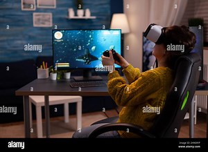 Gamer woman wearing virtual reality headset while playing space shooter video games for online competition on computer usimg gaming joystick. Streamer player doing entertainment activities Stock Photo - Alamy