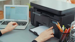 How to set up a multifunction printer with a laptop at home office for easy printing and scanning tasks