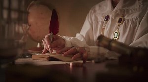 Elegant Hands Writing with Quill Pen on Vintage Paper