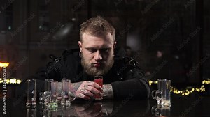 Portrait man drunk drinks an alcoholic drink and loses consciousness Got drunk and passed out