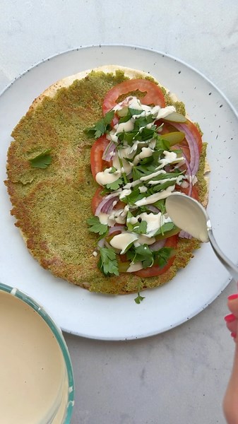 Yumna | Feel Good Foodie on Instagram: "This smash falafel is seriously a smashing hit! It was an idea I saw from @raniaobeidallah and I just knew I had to try it. I love the crispy thin layer of falafel that’s spread all over the pita for a satisfying taste of falafel in every bite! And the best part is it’s actually faster than traditional falafel but with all the flavor! Comment RECIPE for the full recipe!"