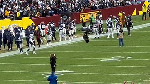 Dak Prescott, CeeDee Lamb, Tony Pollard, Brandin Cooks and their Dallas Cowboys teammates head toward the endzone to spend a moment in prayer before Cowboys/Commanders | Mike Leslie