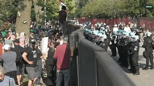 Protesters breach barricade outside the DNC at the United Center