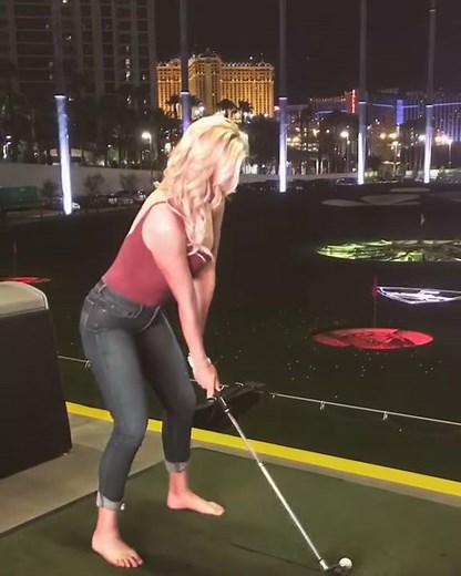 Paige Spiranac golfing barefoot