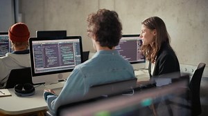 Smart Young Students Studying in University with Diverse Multiethnic Classmates. Scholars Collaborate in College Room on Computer Science Project, Writing Software Code in Successful Teamwork.