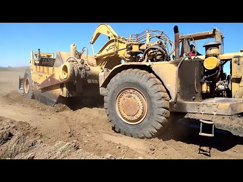 CAT D10 Dozer pushing 651B scrapers- Amazing Power