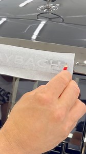 Transfer Paper Trick to Wrap Difficult Grill Details. We’ll show you a simple trick to wrap recessed lettering on a Maybach grill using transfer paper. Since the letters are deep and hard to cut with a knife, we make a custom template by applying transfer paper, sketching the letters with a pencil, cutting them out manually, and then applying the white vinyl into the black chrome surface. Clean, precise, and visually striking.#Maybach #Wrapping #Detailing #GrillWrap #VinylTrick #TransferPaper #L