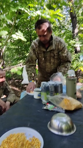 Soldiers' Outdoor Cooking in a Forest Camp