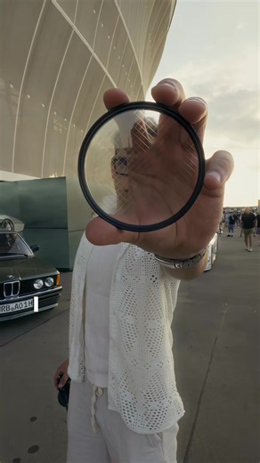 64K views · 37 reactions | She was shocked when she saw how her photos looked through the AURORA CRYSTAL Filter. Cars lights turned into glowing reflections — pure cinematic magic straight from the lens. ✅ Fits all camera brands | ReflectLens | Facebook