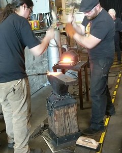 #Blacksmith faculty demonstrating technique where the director (with the small hammer) shows the striker (big hammer) where to hammer the piece. #Demos at #FireAndLightSoirée! | The Crucible | Facebook
