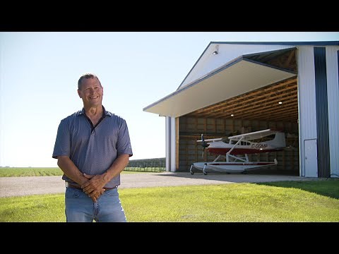 Commercial Bi-fold Hangar Door for Aerial Applicator Roland Air Spray | Diamond Doors