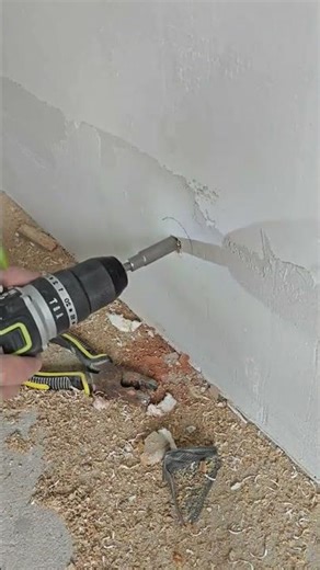 Installing a door stopper without a vise using a socket for better grip