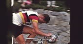 Footage of the 1960 Tour de France. Official vehicles pass by first,...