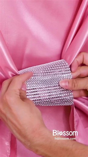 This folding chair is better dressed than the wedding party! 🎀🪑 Upgrade your wedding or formal event with creative chair sash ideas. #blossom #chairsash #wedding #diywedding #formalevent #tabledecoration