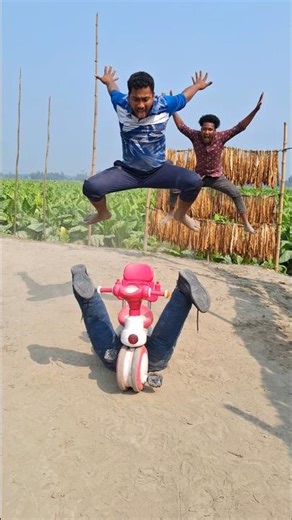 The boy put the motorcycle between his legs.