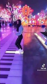 Girl play piano with feet