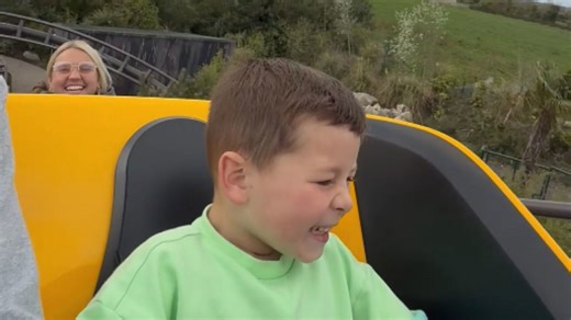 Adorable kid's face says it all during scary roller coaster thrill ride
