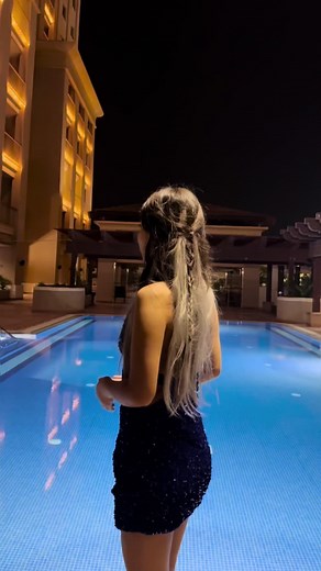 Elegant Nighttime Poolside Fashion Showcase