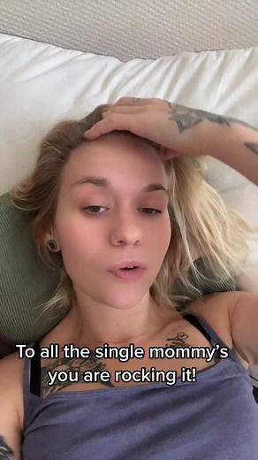 Blonde Woman Exhaling Smoke in Minimalist Room