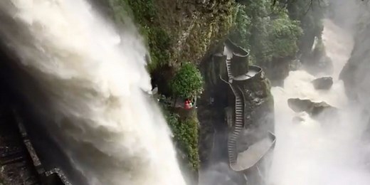 Dangerous, winding stairs take you super close to a massive waterfall in Ecuador