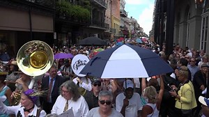 Emotional scenes during Pete Fountain's funeral procession on Royal Street yesterday. Hundreds took to Royal Street for a planned second line following services inside St. Louis Cathedral. The procession ended at Hotel Monteleone, where the marching band played on as paraders danced in place and celebrated Fountain's life. | WWOZ 90.7 FM New Orleans