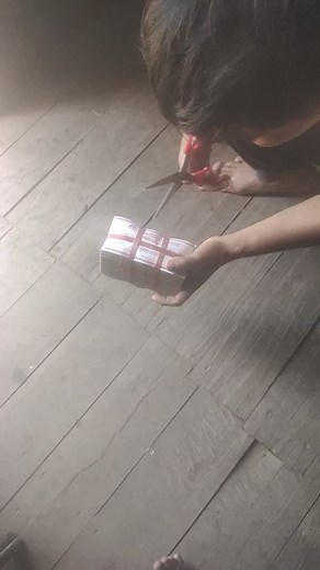 Cutting Banknotes with Red Scissors: A Unique Display