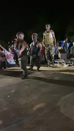 Energetic Night Dance Performance Under Street Lights