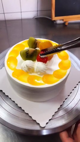 Burnishing Yellow Designed Cake With Fruits Icing Cake