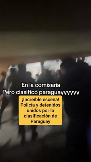 Police and detainees in a station united by Paraguay’s qualification against Germany.