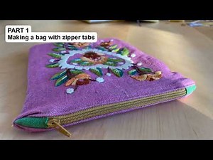 Lined zipper pouch with zipper tabs